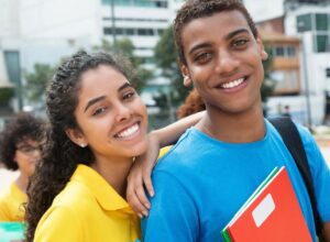 Two students smiling