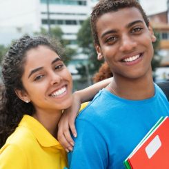 Two students smiling